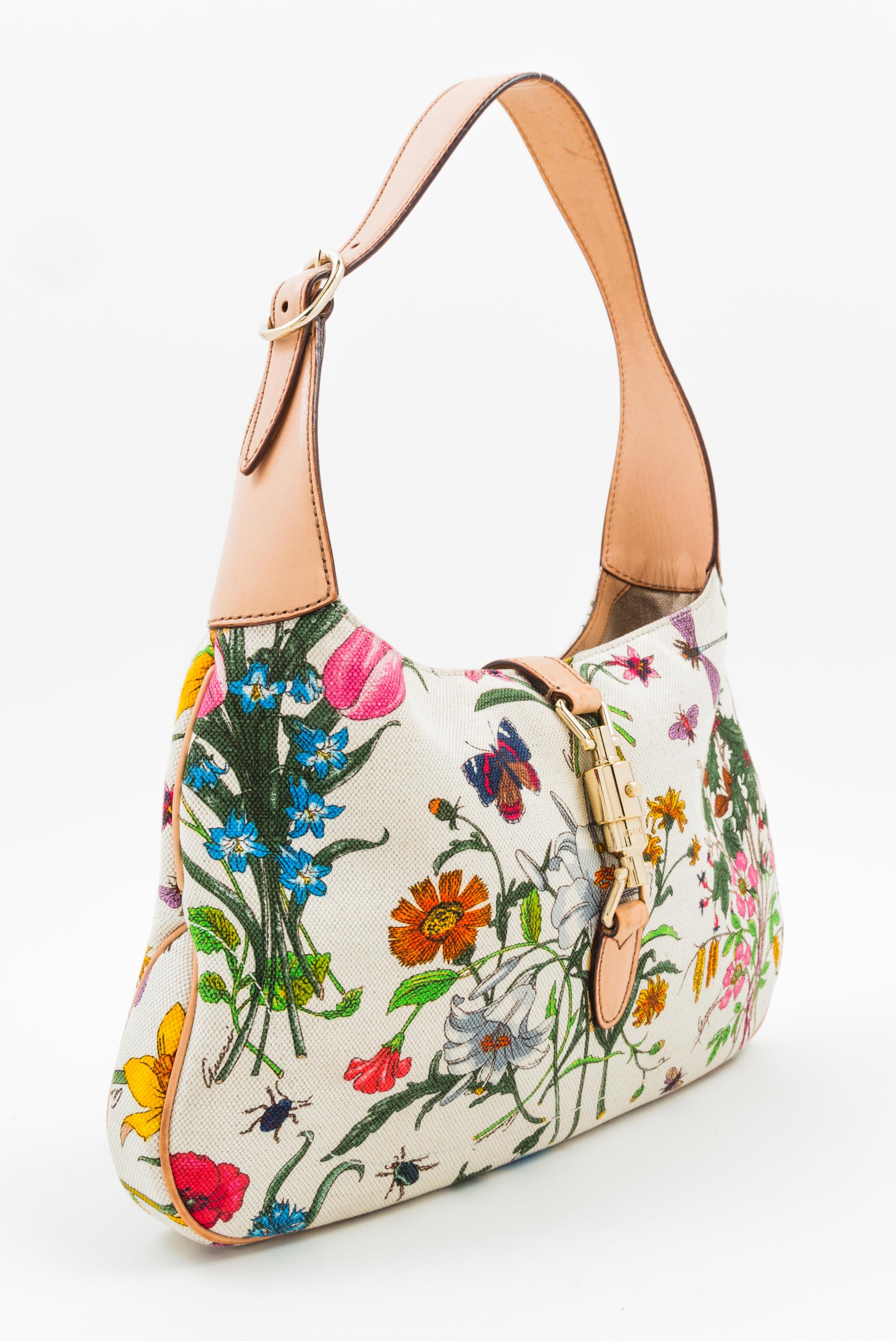 A Gucci Floral Canvas Handbag, 12" x 8" x 1.5"; Strap drop: 9".