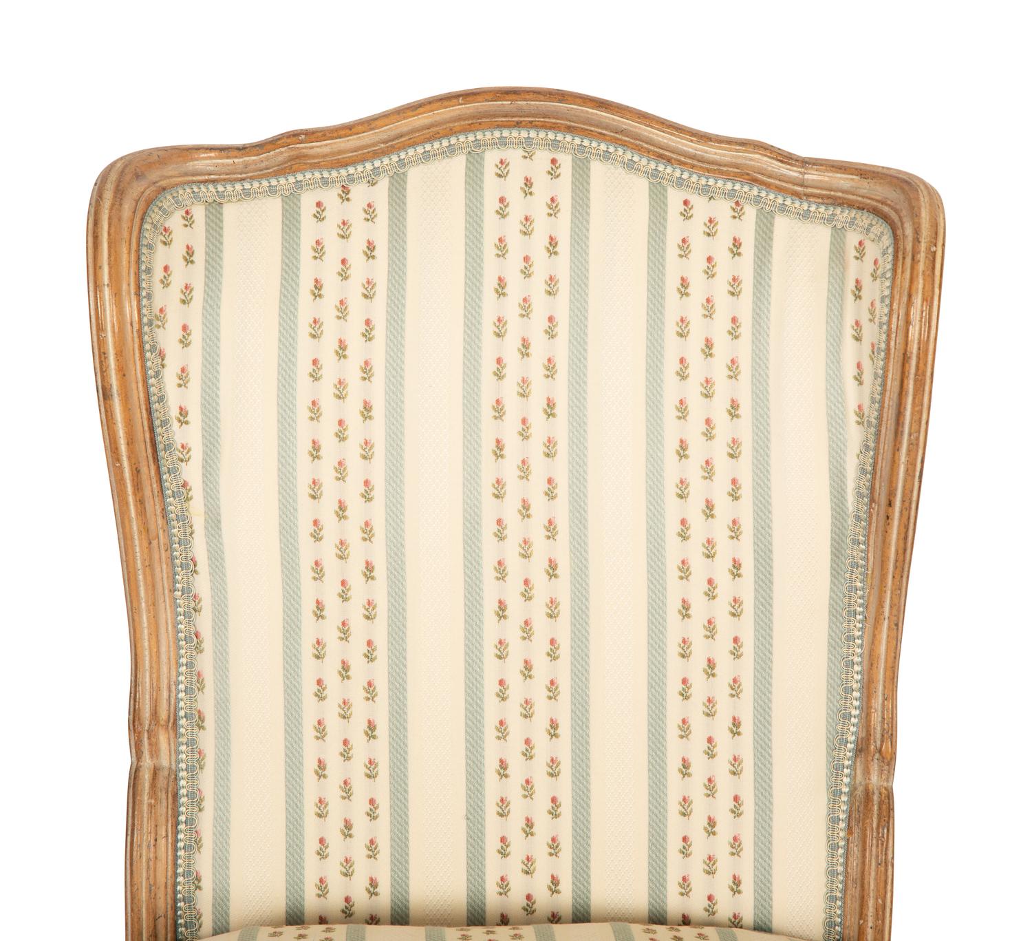 A Pair of Louis XV Style Carved Fruitwood Slipper Chairs