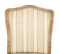 A Pair of Louis XV Style Carved Fruitwood Slipper Chairs
