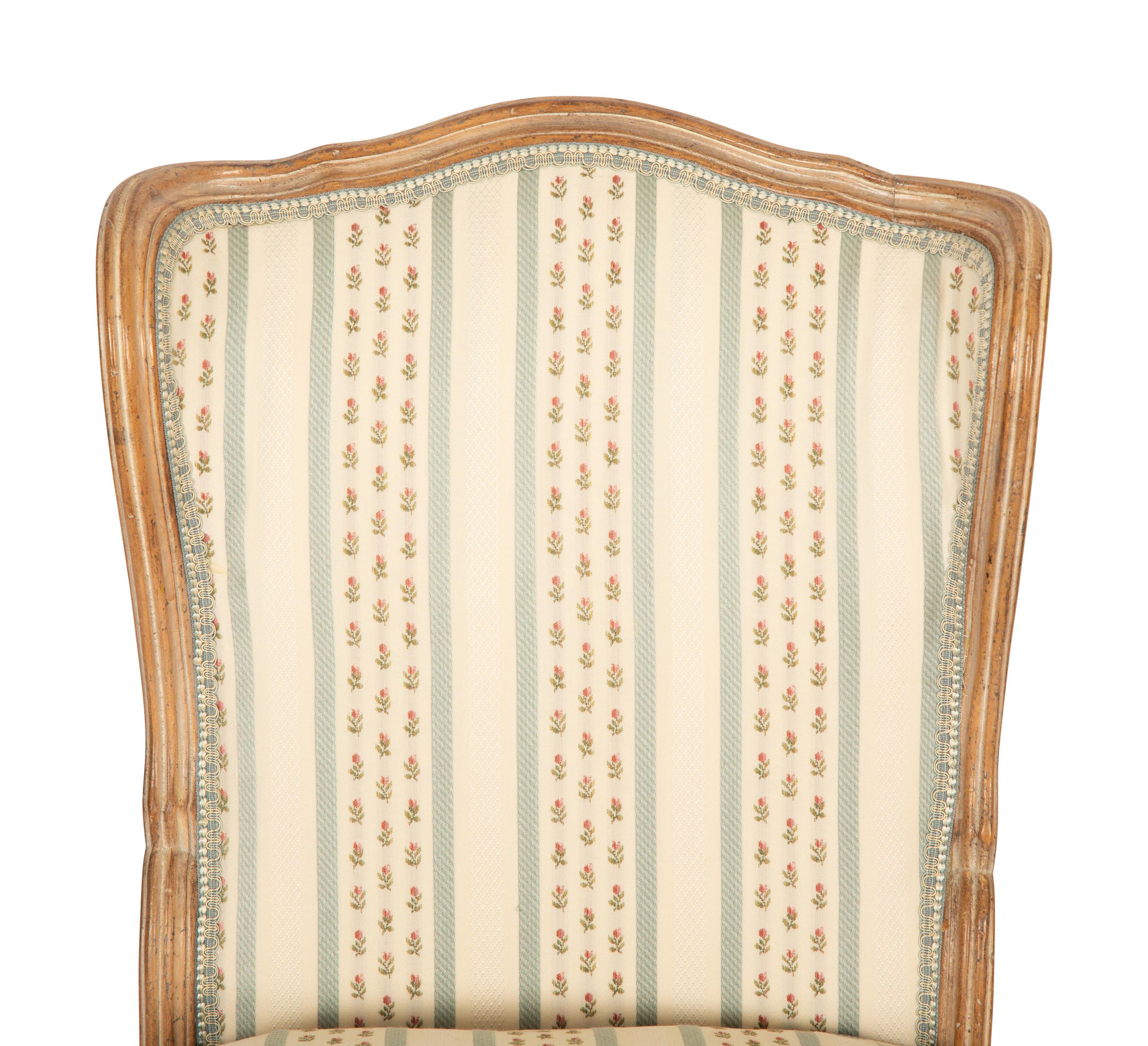 A Pair of Louis XV Style Carved Fruitwood Slipper Chairs