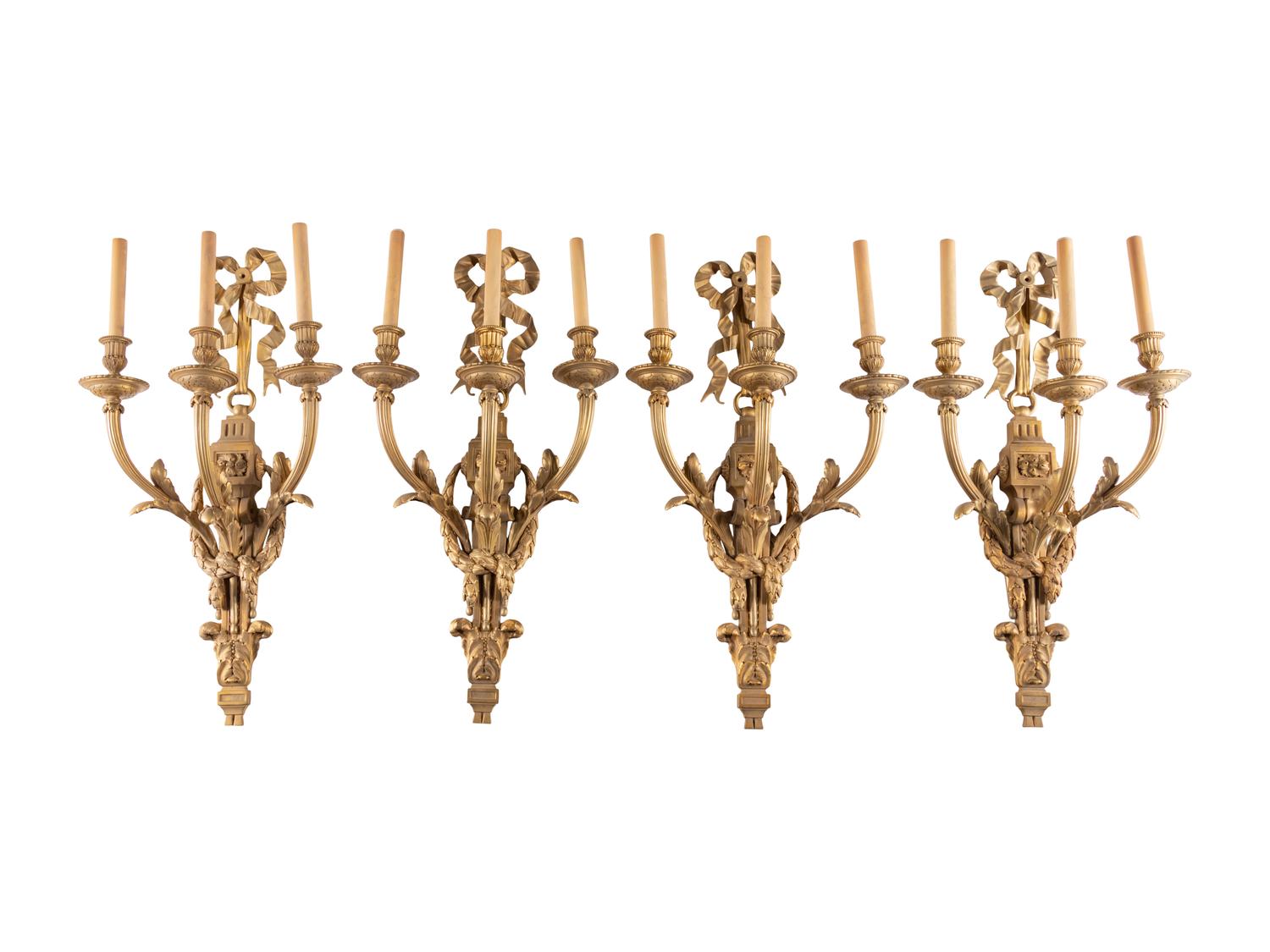 A Set of Eight Louis XVI Style Gilt Bronze Three-Light Sconces