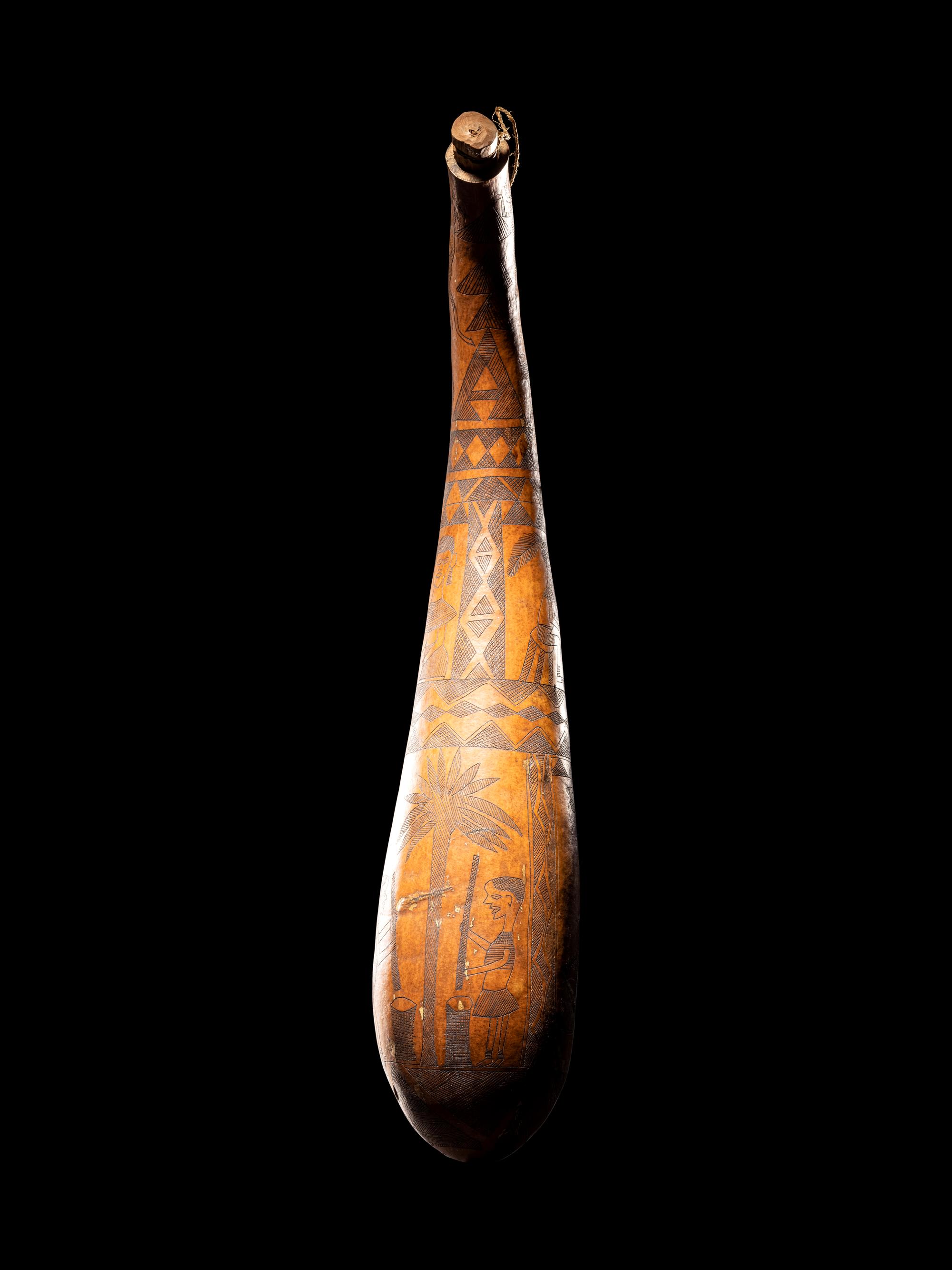 A Maasai Painted Hide Shield and Milk Gourd