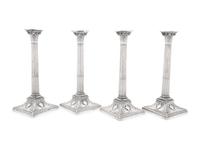 An Assembled Set of Four Victorian and Edwardian Silver Candlesticks