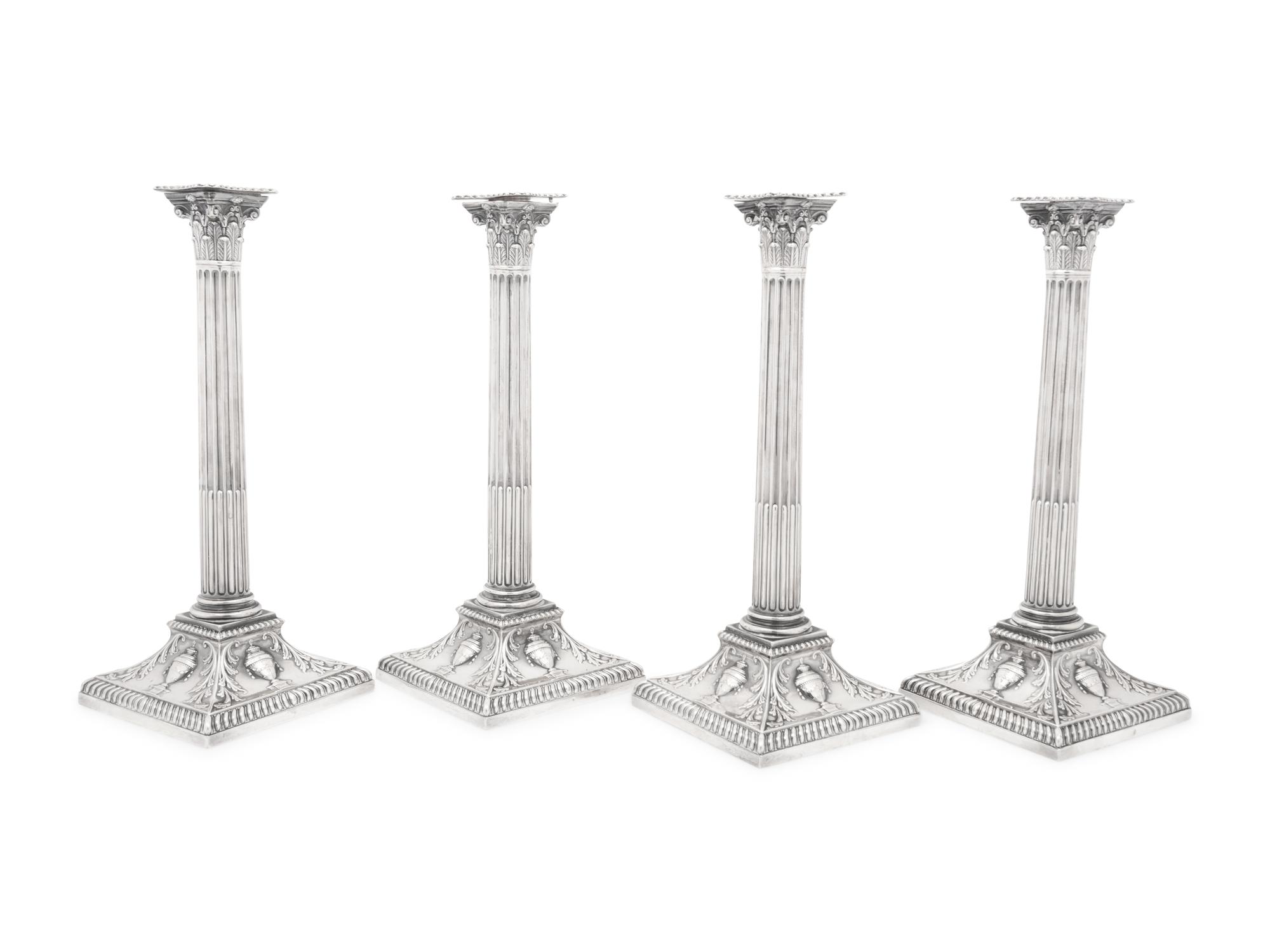 An Assembled Set of Four Victorian and Edwardian Silver Candlesticks