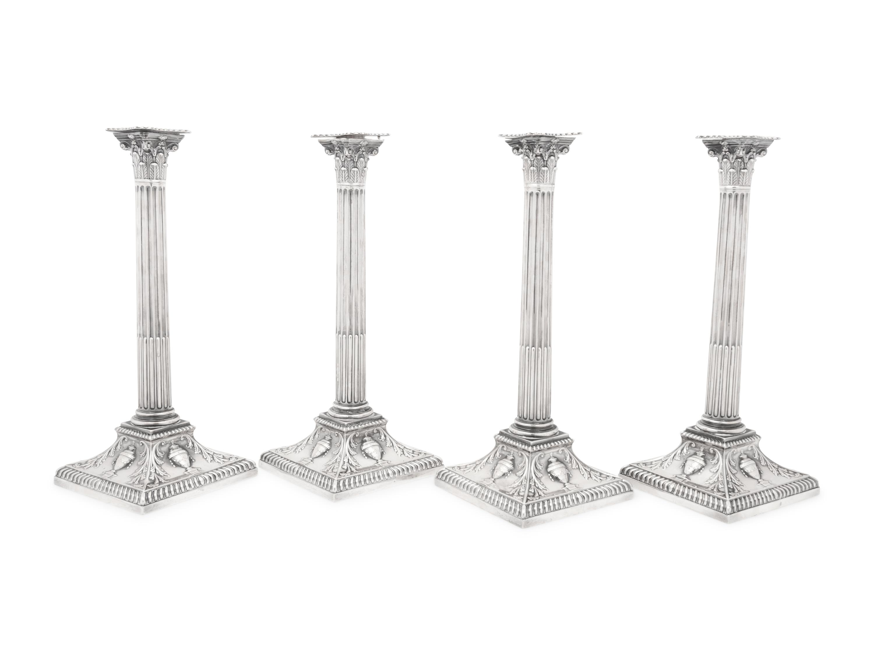 An Assembled Set of Four Victorian and Edwardian Silver Candlesticks