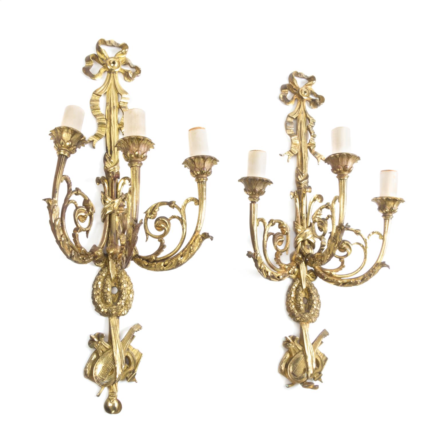 A Pair of Louis XVI Style Gilt Bronze Three-Light Sconces Height 24 1/2 inches.