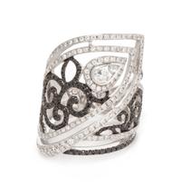 An 18 Karat White Gold, Diamond and Black Diamond Ring, 8.80 dwts.