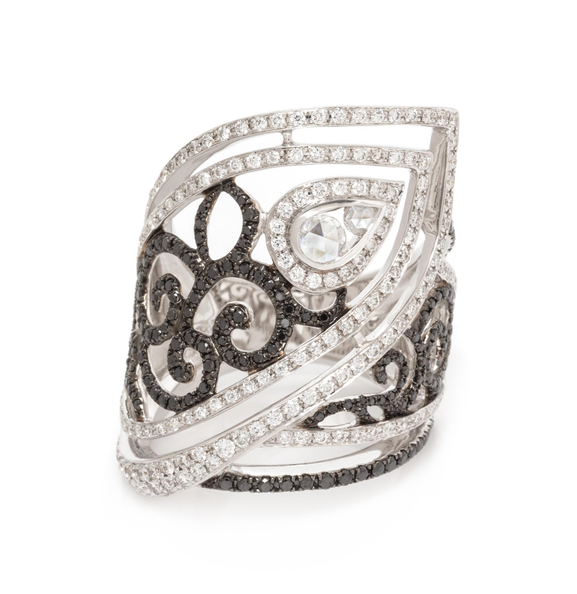 An 18 Karat White Gold, Diamond and Black Diamond Ring, 8.80 dwts.
