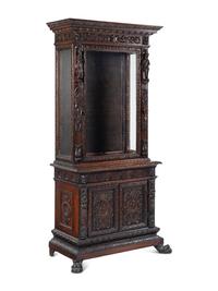 An Austrian Carved Walnut Cabinet