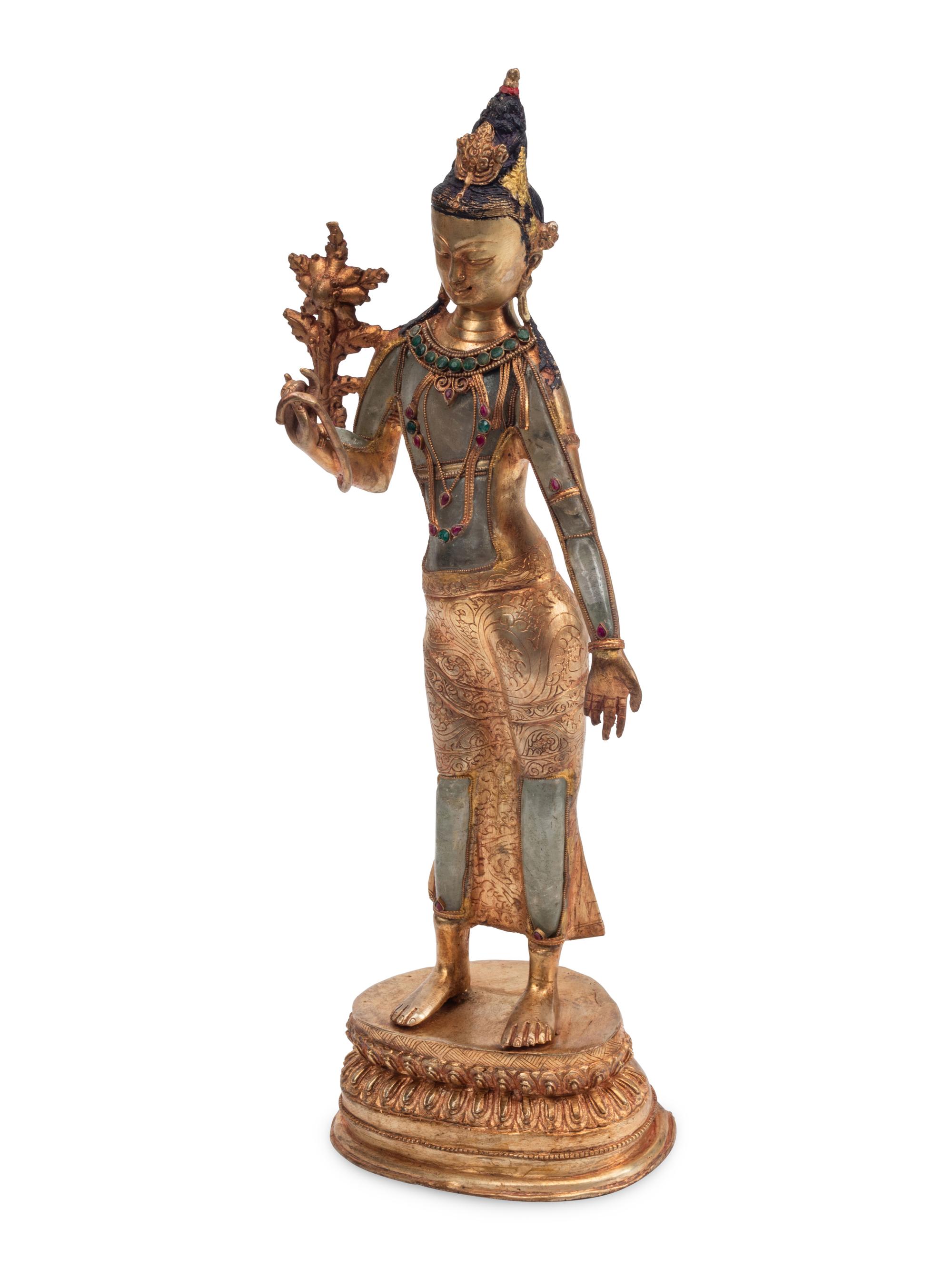 A Gilt Bronze and Rock Crystal Standing Deity