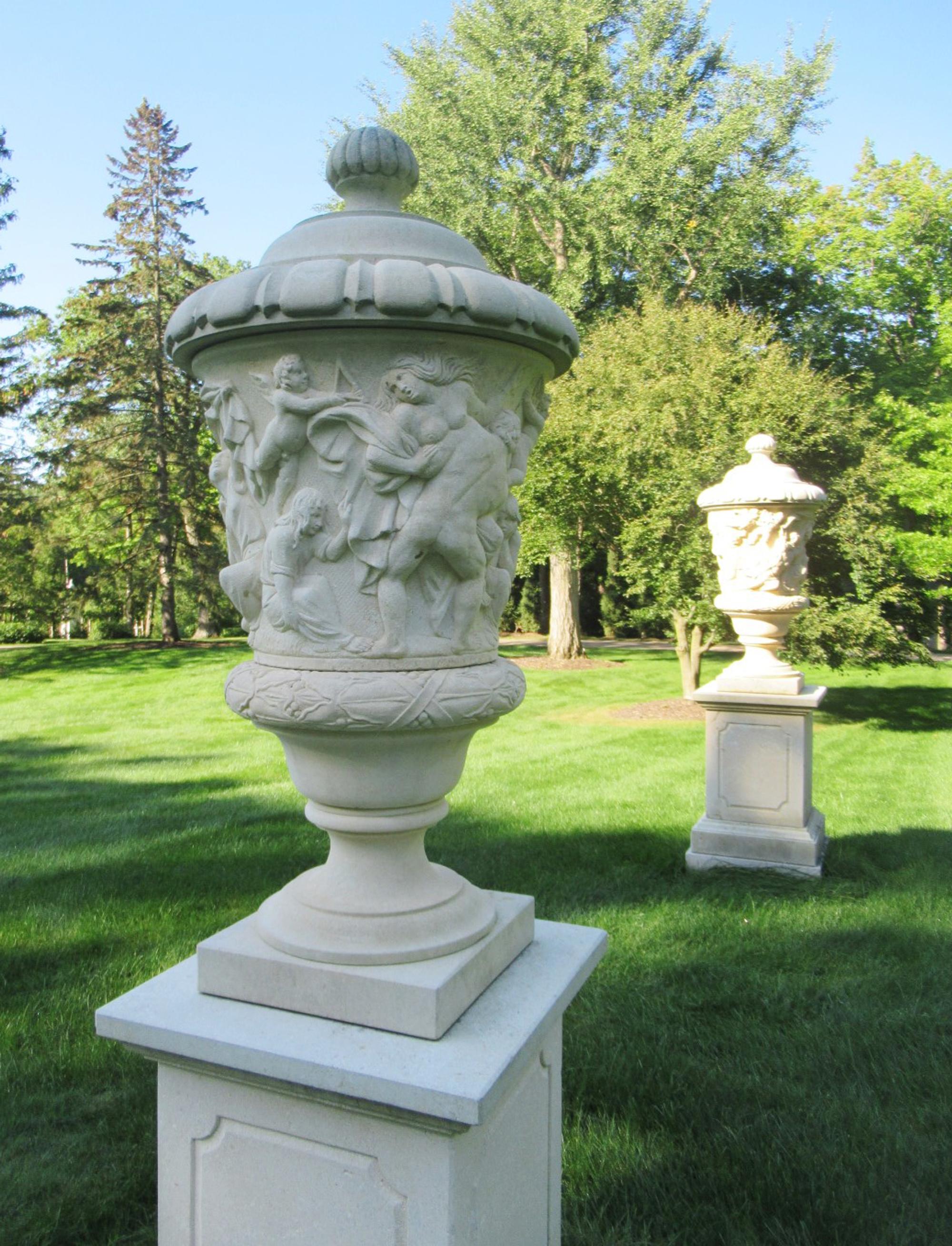 A Pair of Large Limestone Lidded Urns