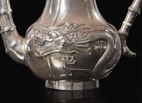 A Chinese export silver five-piece "Dragon" tea and coffee service and tongs, mark of Zeewo, Shanghai, late 19th to early 20th century 一組五件銀質咖啡器及茶具 Zeewo款 上海 十九世紀末至二十世紀初