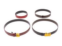 A Group of Two Cartier Belt Buckles and Four Straps