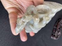 A Chinese jade "Boys, Kylin and Phoenix" vase on carved wood stand 玉雕童子凤鸟花樽及底座