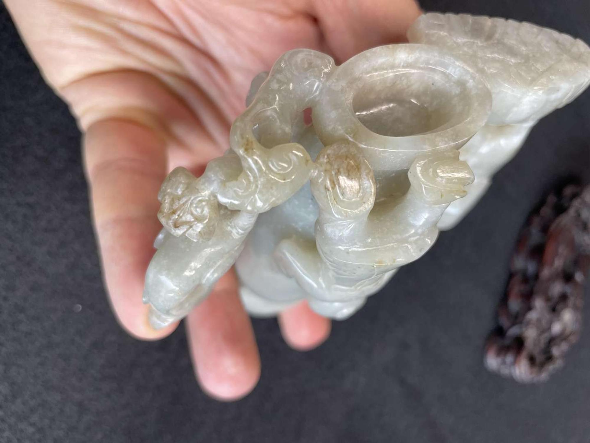 A Chinese jade "Boys, Kylin and Phoenix" vase on carved wood stand 玉雕童子凤鸟花樽及底座