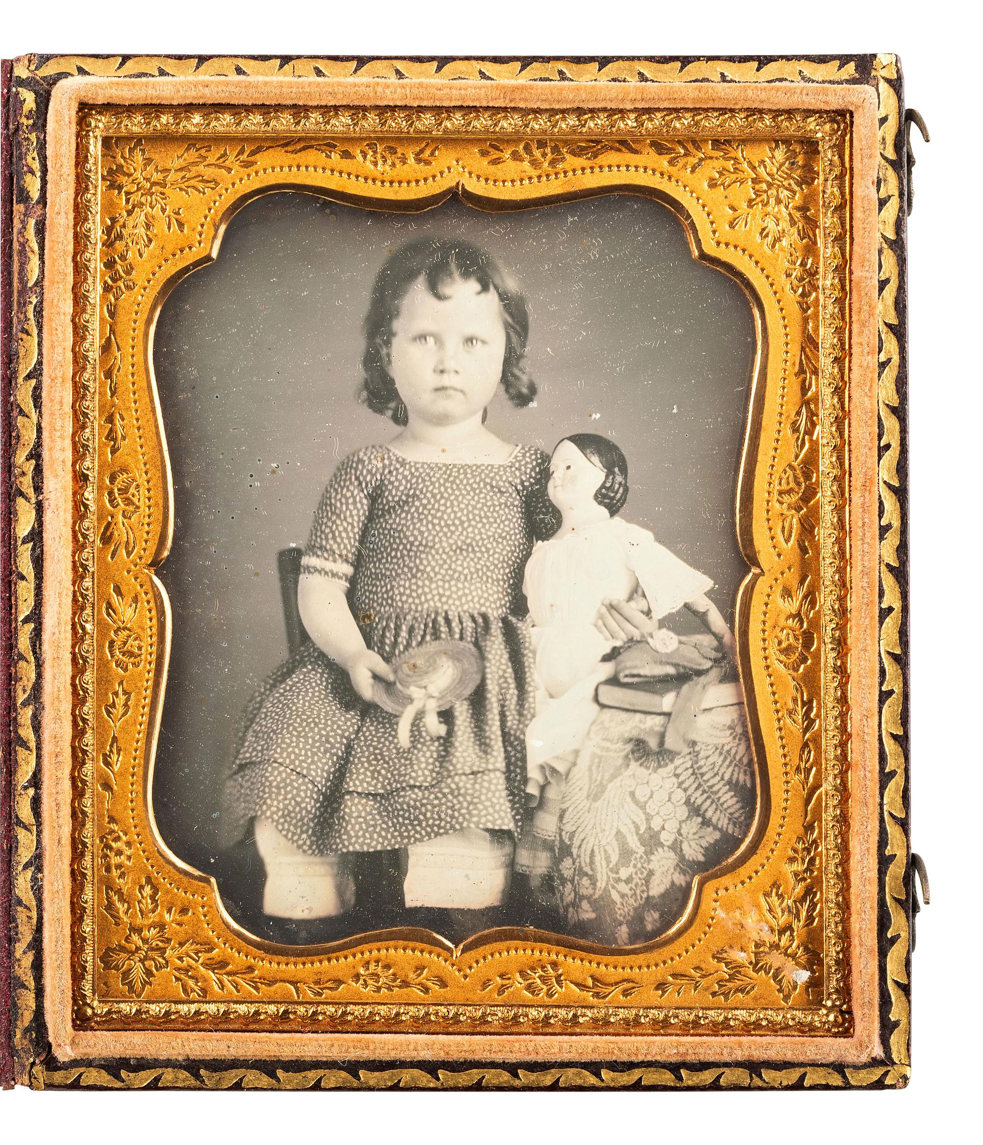 [EARLY PHOTOGRAPHY]. Sixth plate daguerreotype portrait of a little girl with her doll.