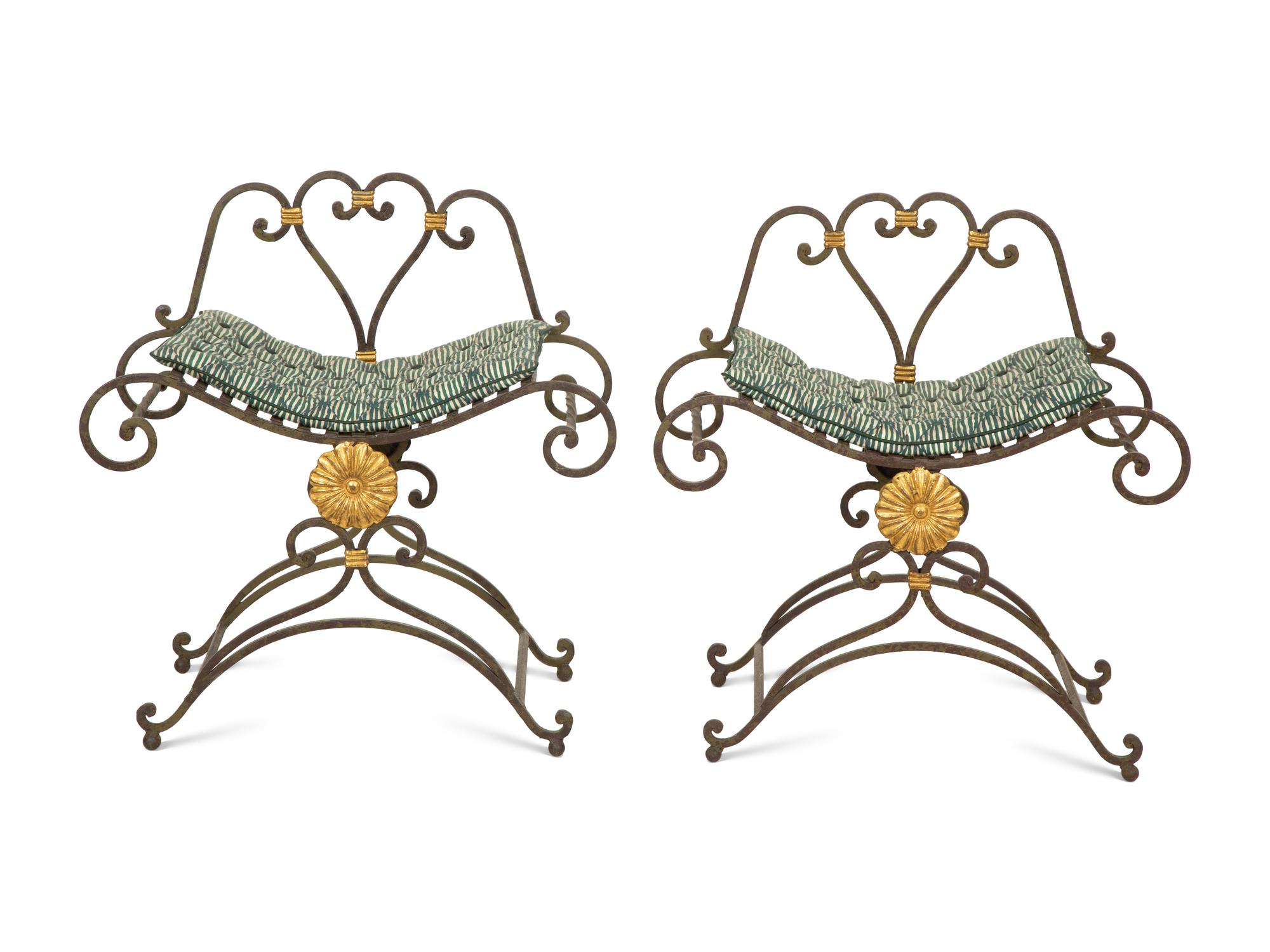 A Pair of Painted and Parcel Gilt Iron Curule Stools with Tufted Cushions