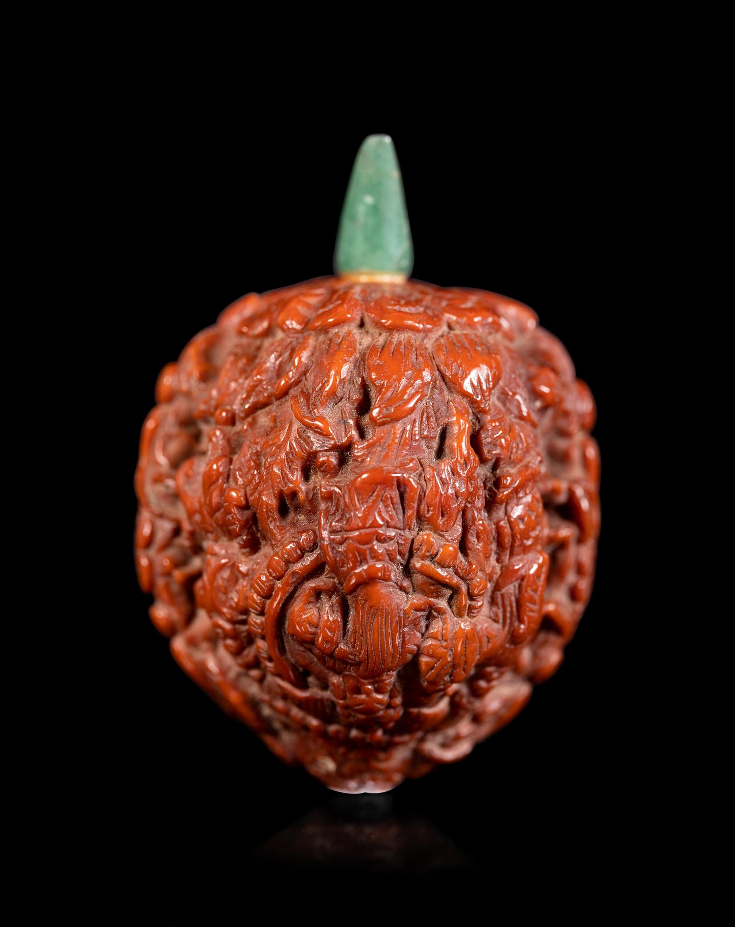 A Chinese Carved Peach Pit Snuff Bottle