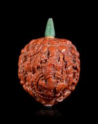 A Chinese Carved Peach Pit Snuff Bottle