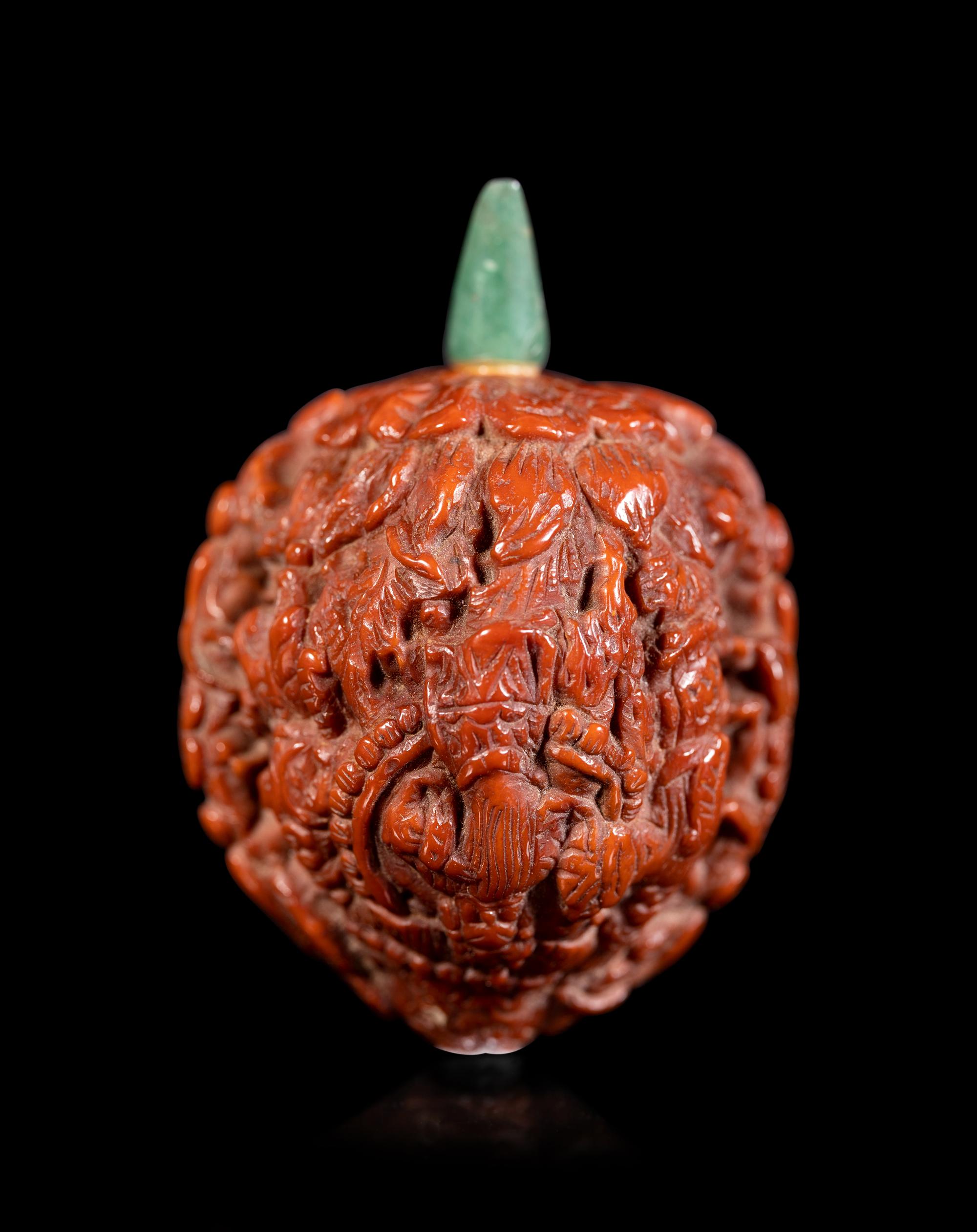 A Chinese Carved Peach Pit Snuff Bottle