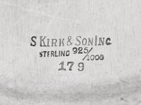A Group of Four S. Kirk and Son Repousse Silver Table Articles