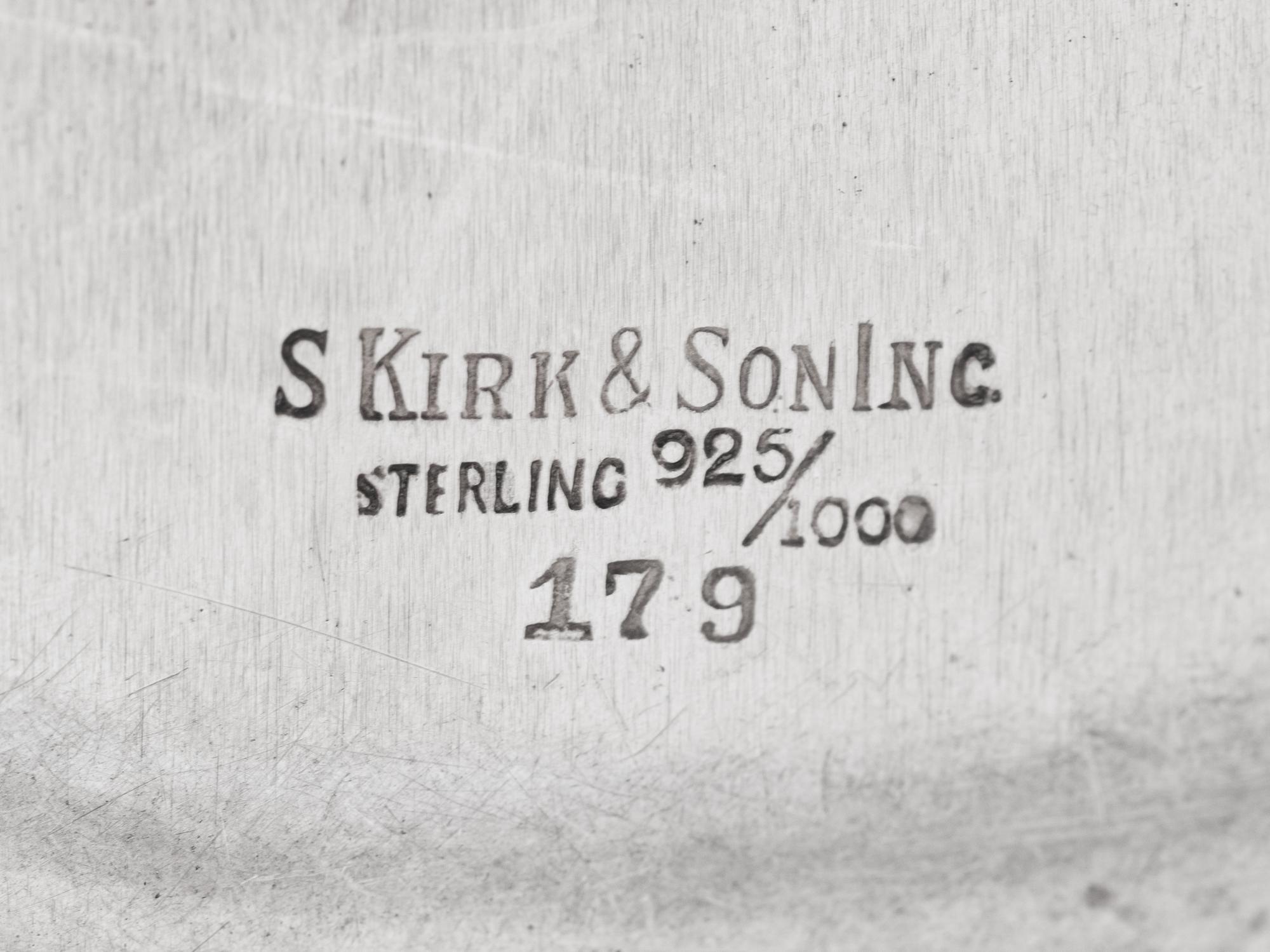 A Group of Four S. Kirk and Son Repousse Silver Table Articles