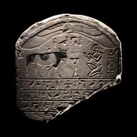 An Egyptian Limestone Round-Topped Stele