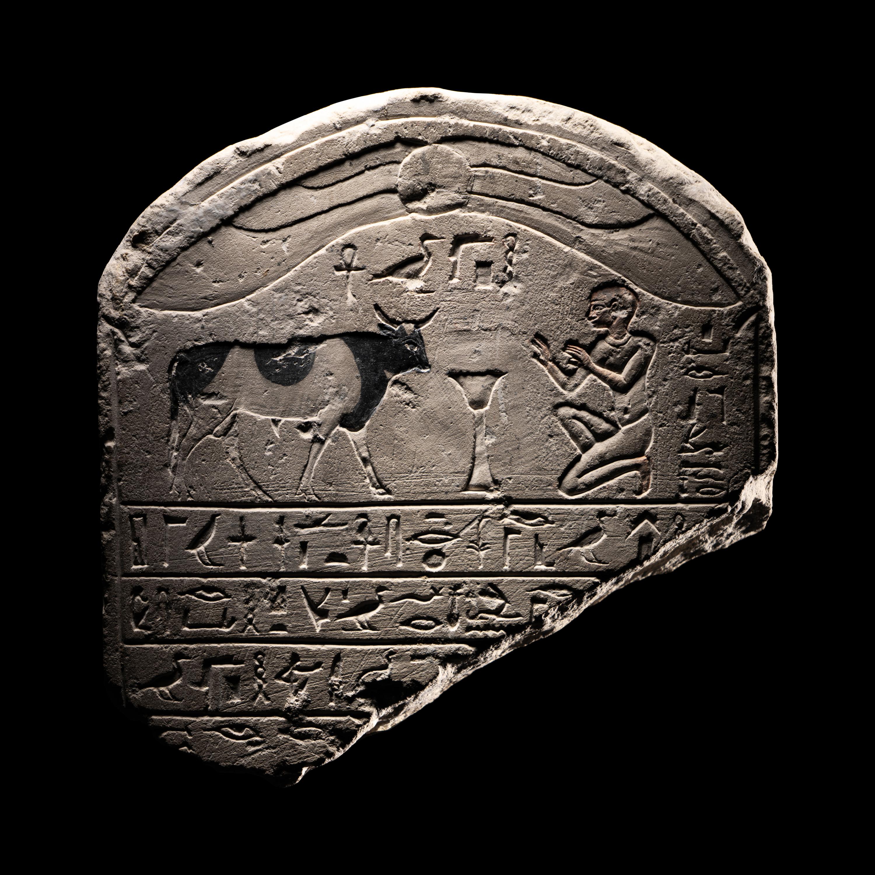 An Egyptian Limestone Round-Topped Stele