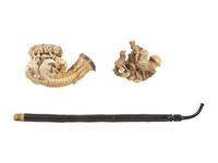 [AMERICANA - PIPES]. 2 ornately carved meerschaum pipes, each featuring animal motifs.