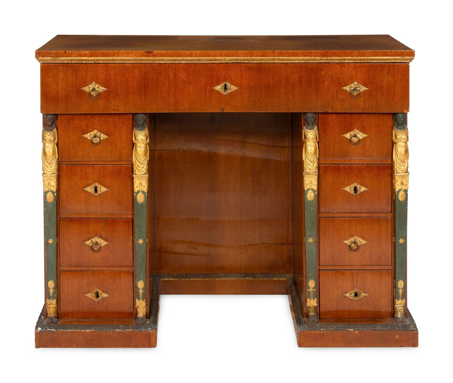 A Continental Empire Style Painted and Parcel-Gilt Mahogany-Veneered Kneehole Desk