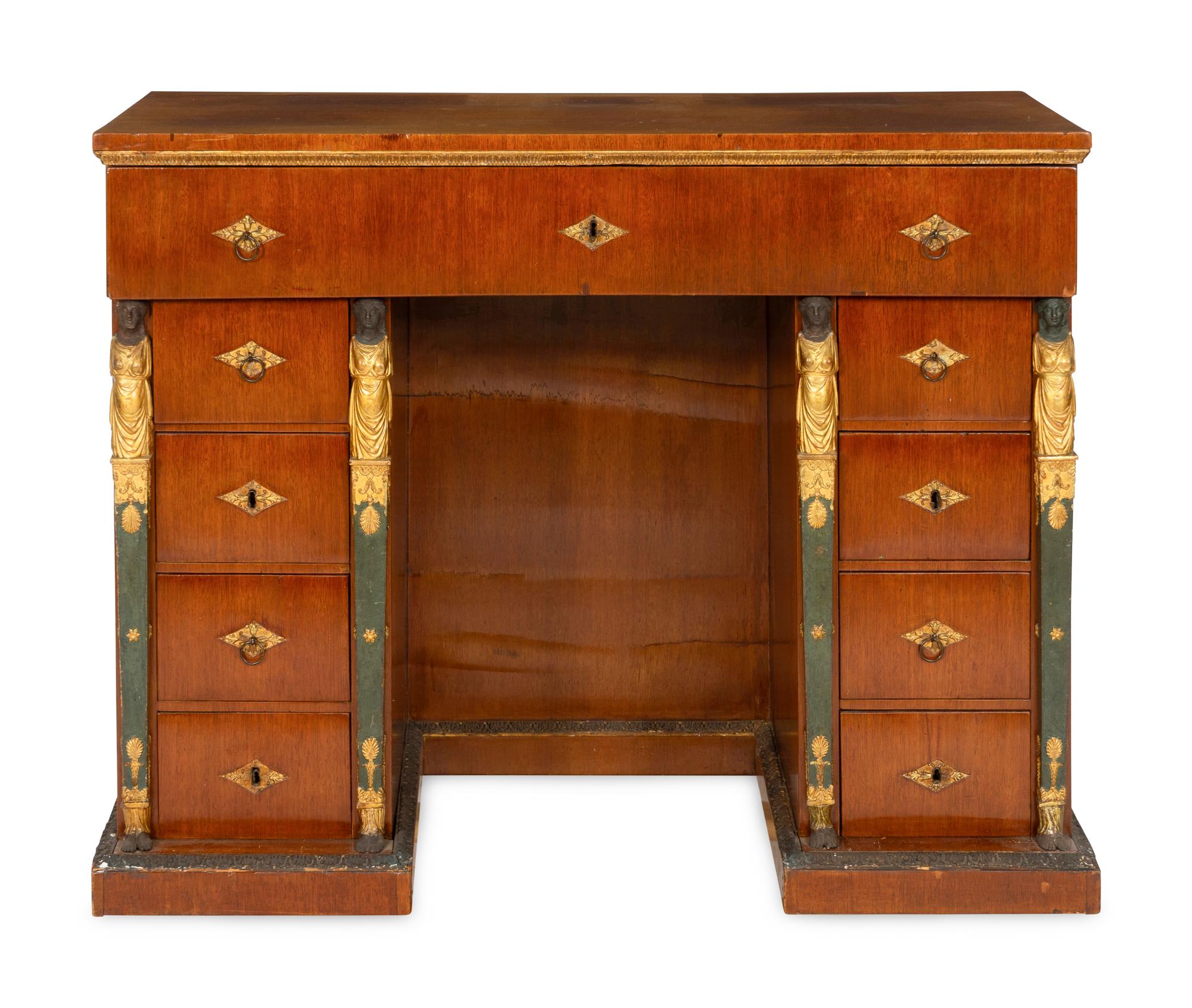 A Continental Empire Style Painted and Parcel-Gilt Mahogany-Veneered Kneehole Desk