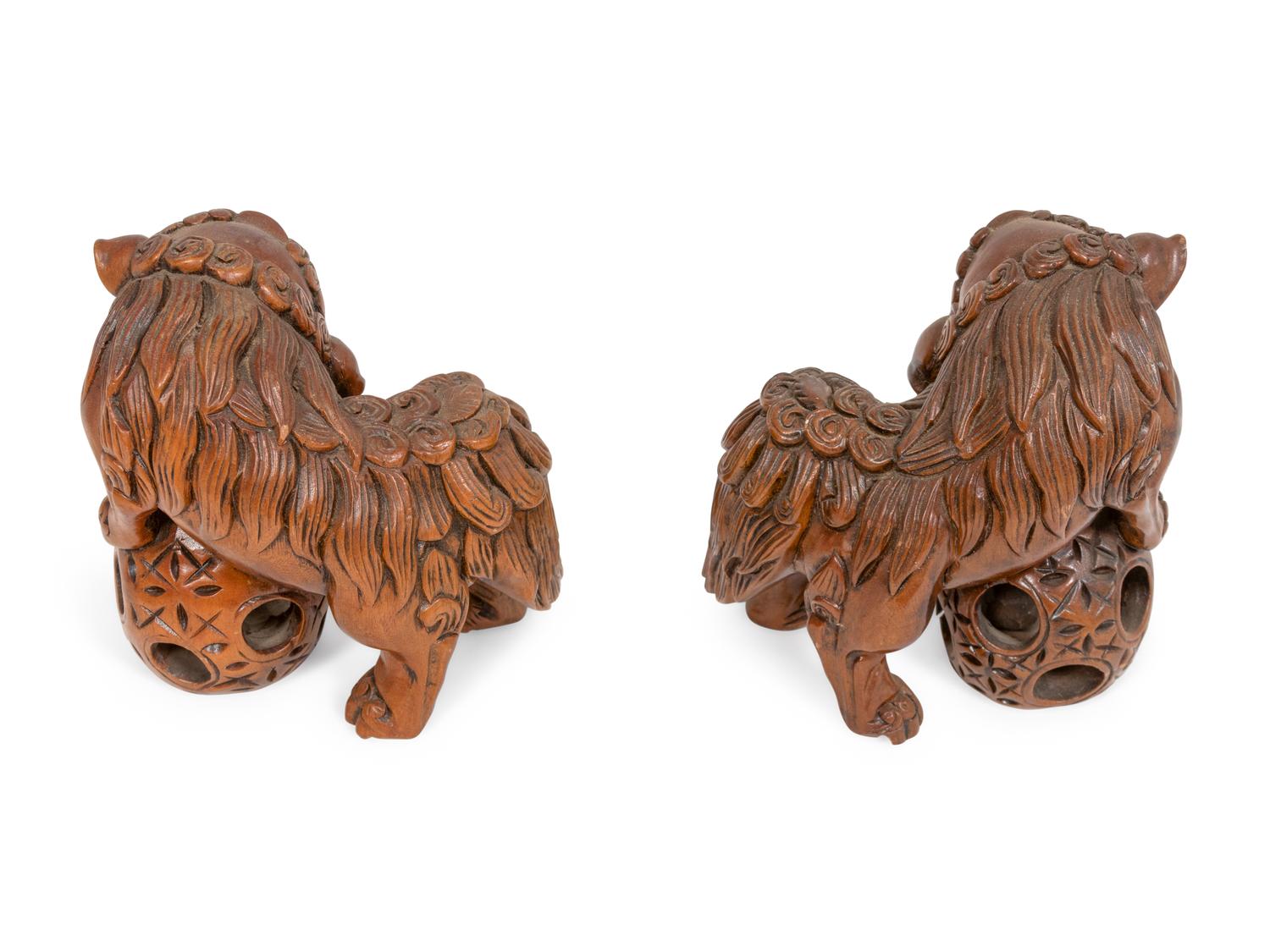 A Pair of Carved Wood Guardian Lions