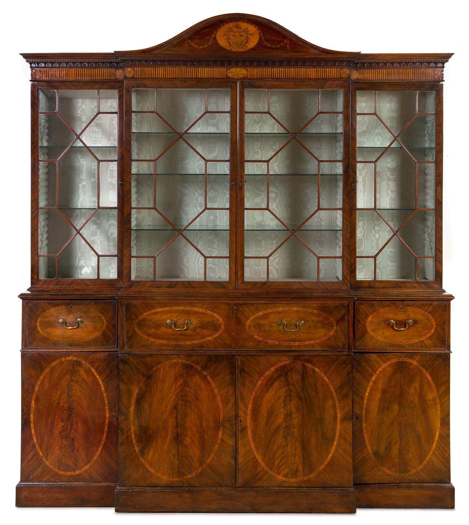 A George III Inlaid Mahogany Breakfront Bureau Bookcase Height 8 feet 2 inches x width 7 feet 2 1/2 inches x depth 23 inches. — CIRCA 1780