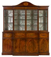 A George III Inlaid Mahogany Breakfront Bureau Bookcase Height 8 feet 2 inches x width 7 feet 2 1/2 inches x depth 23 inches. — CIRCA 1780