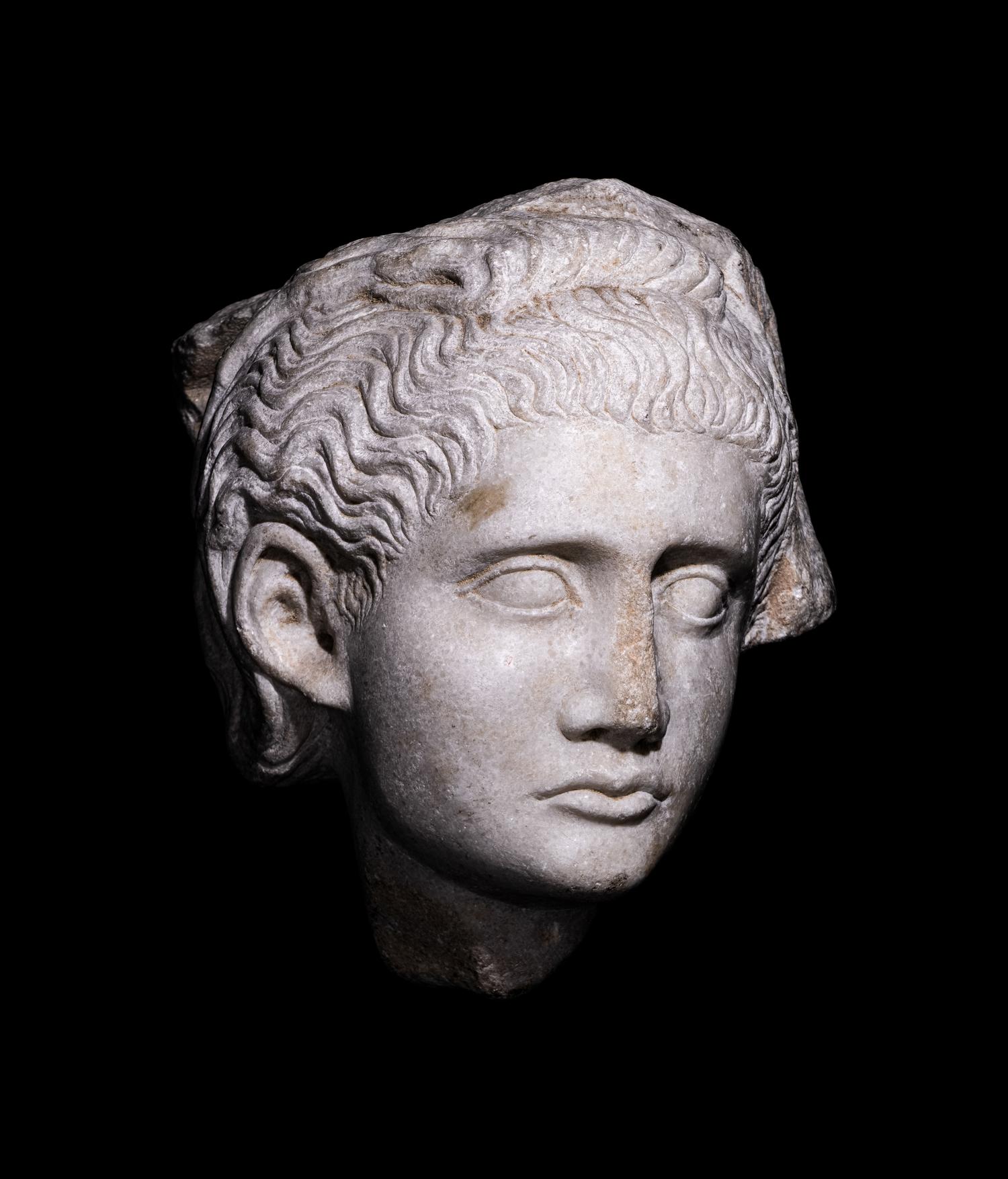 A Roman Marble Relief with a Female Head