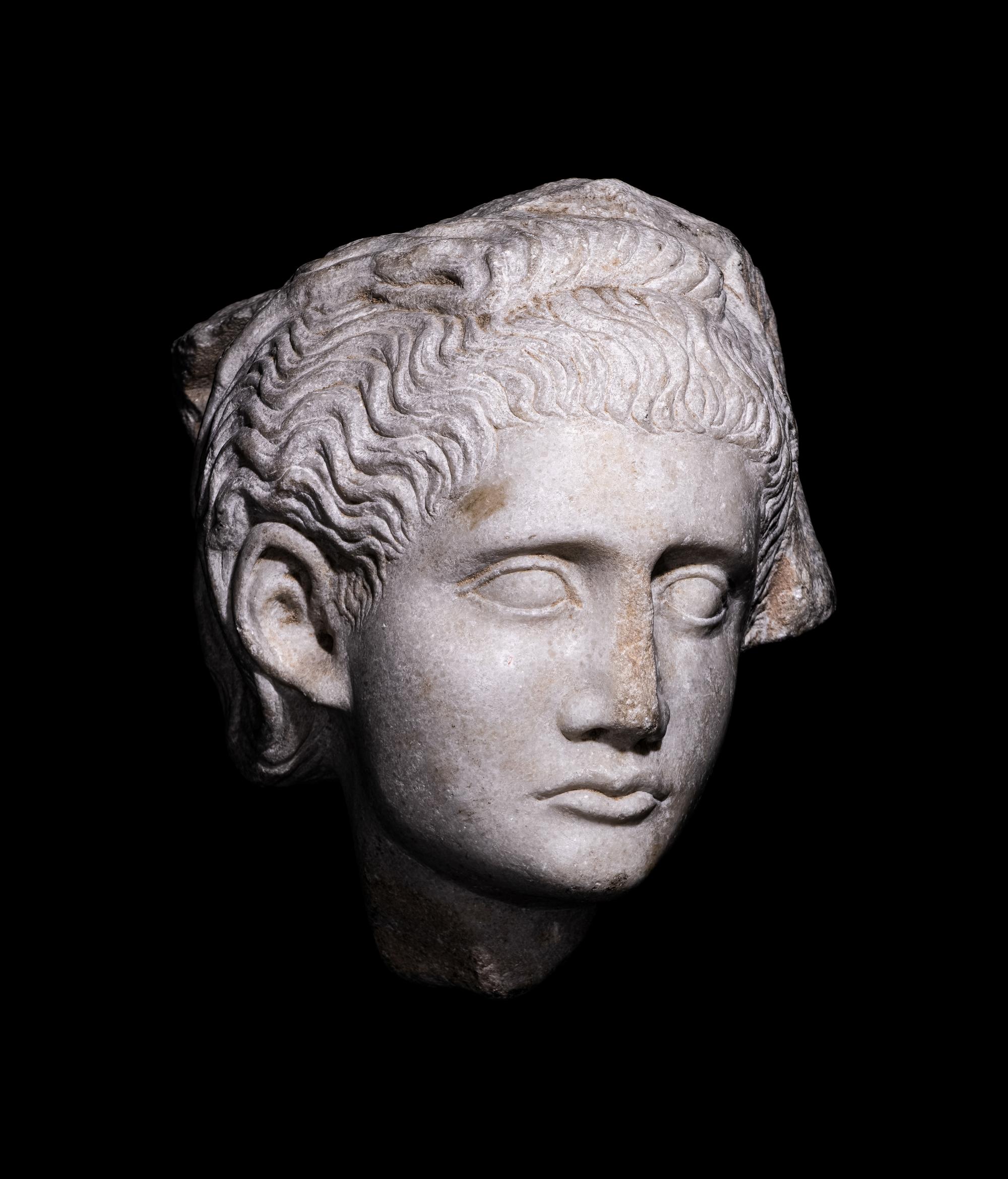 A Roman Marble Relief with a Female Head