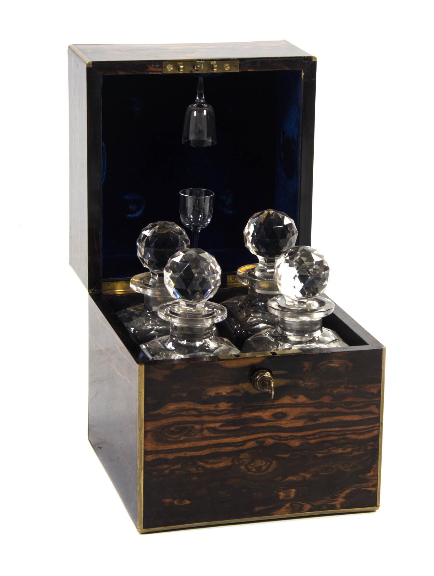 A Regency Calamander Cased Liquor Set, Height 10 1/4 x width 9 x depth 9 inches.