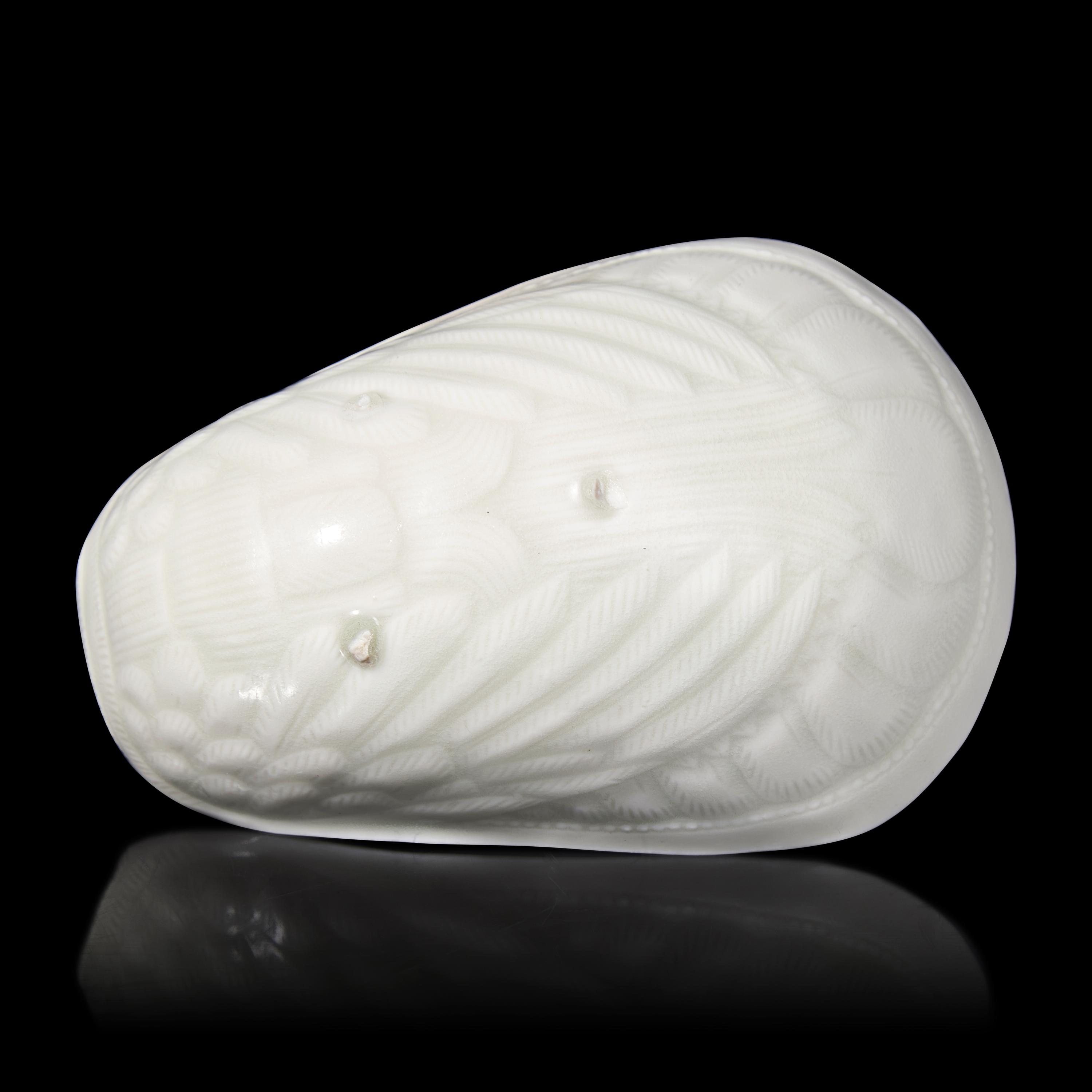 A Chinese Transparent Glazed 'Parrot' Cup, Song Dynasty 宋 白瓷鸚鵡杯