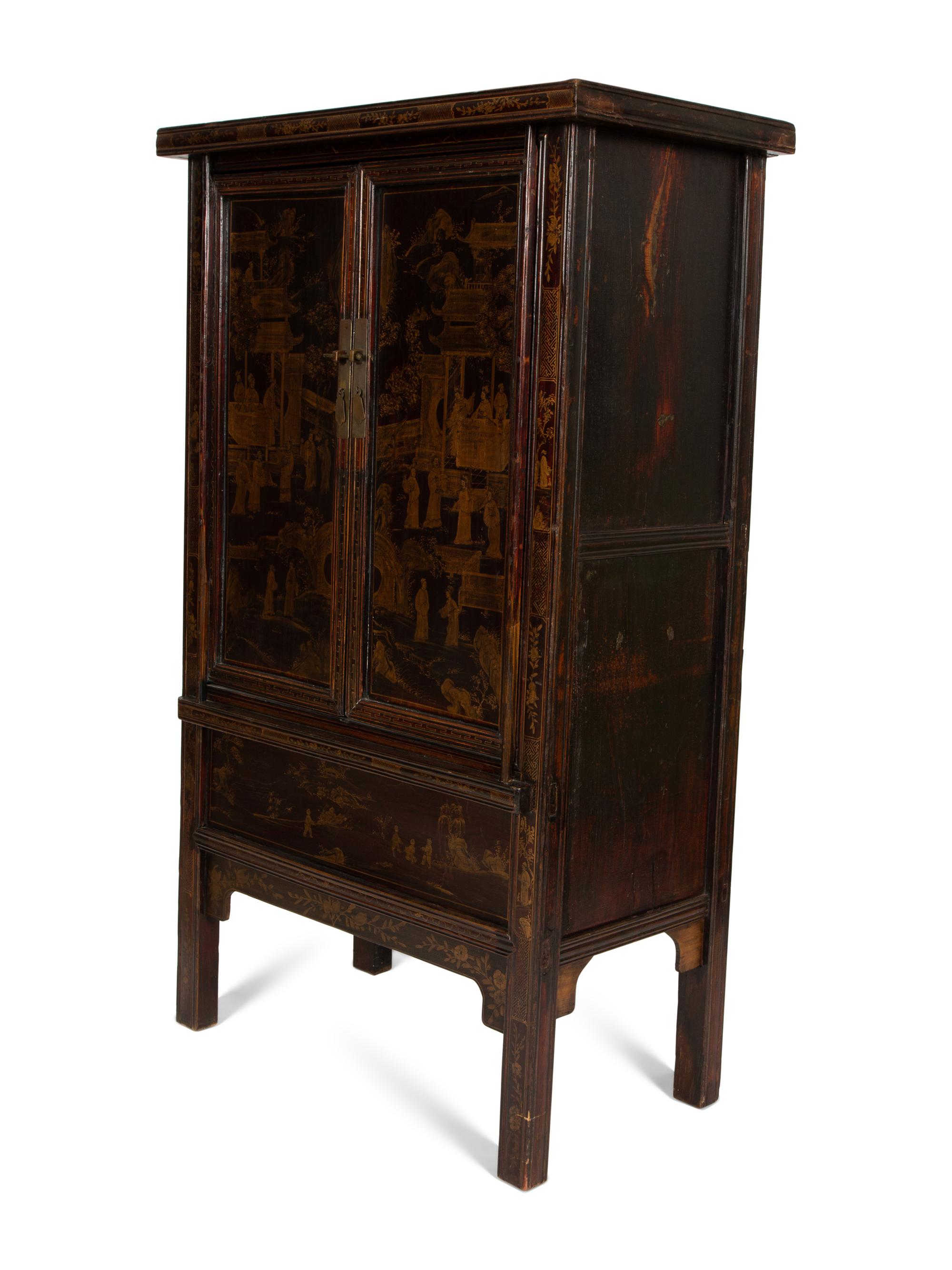 A Chinese Black Lacquer and Parcel Gilt Cabinet