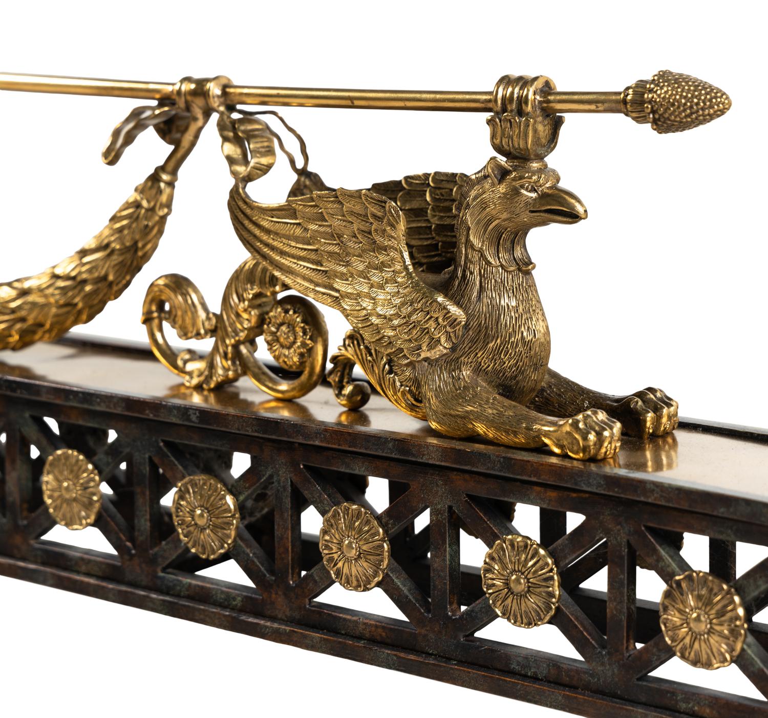 An Empire Style Gilt and Patinated Bronze Fireplace Fender