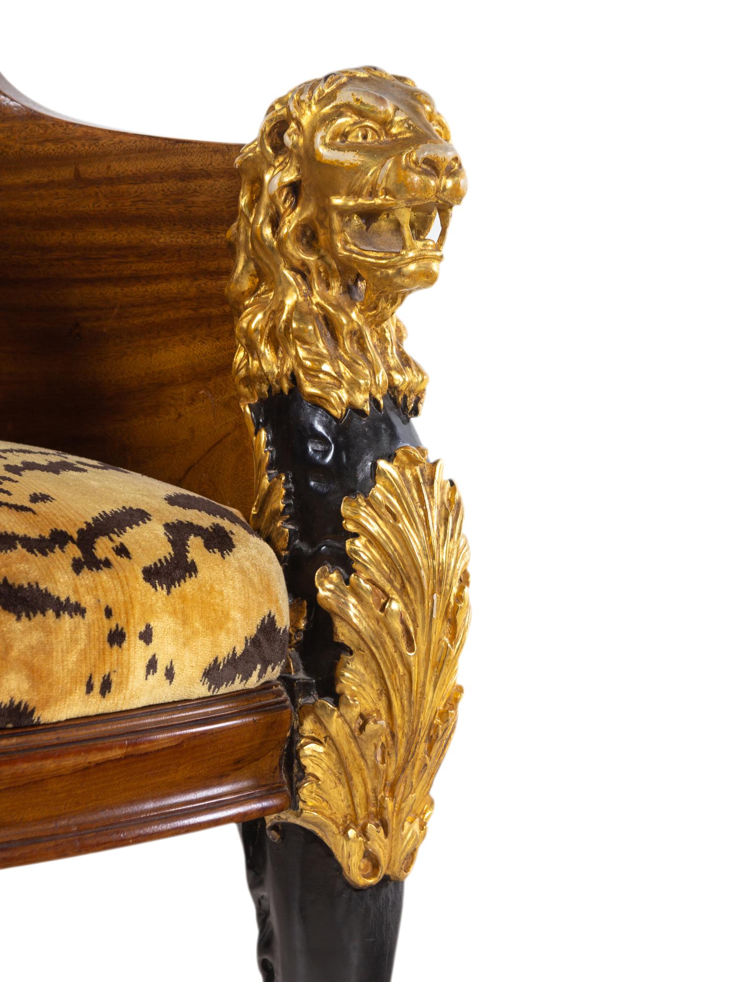 An Italian Empire Style Parcel Gilt Mahogany Armchair