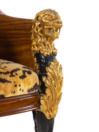 An Italian Empire Style Parcel Gilt Mahogany Armchair