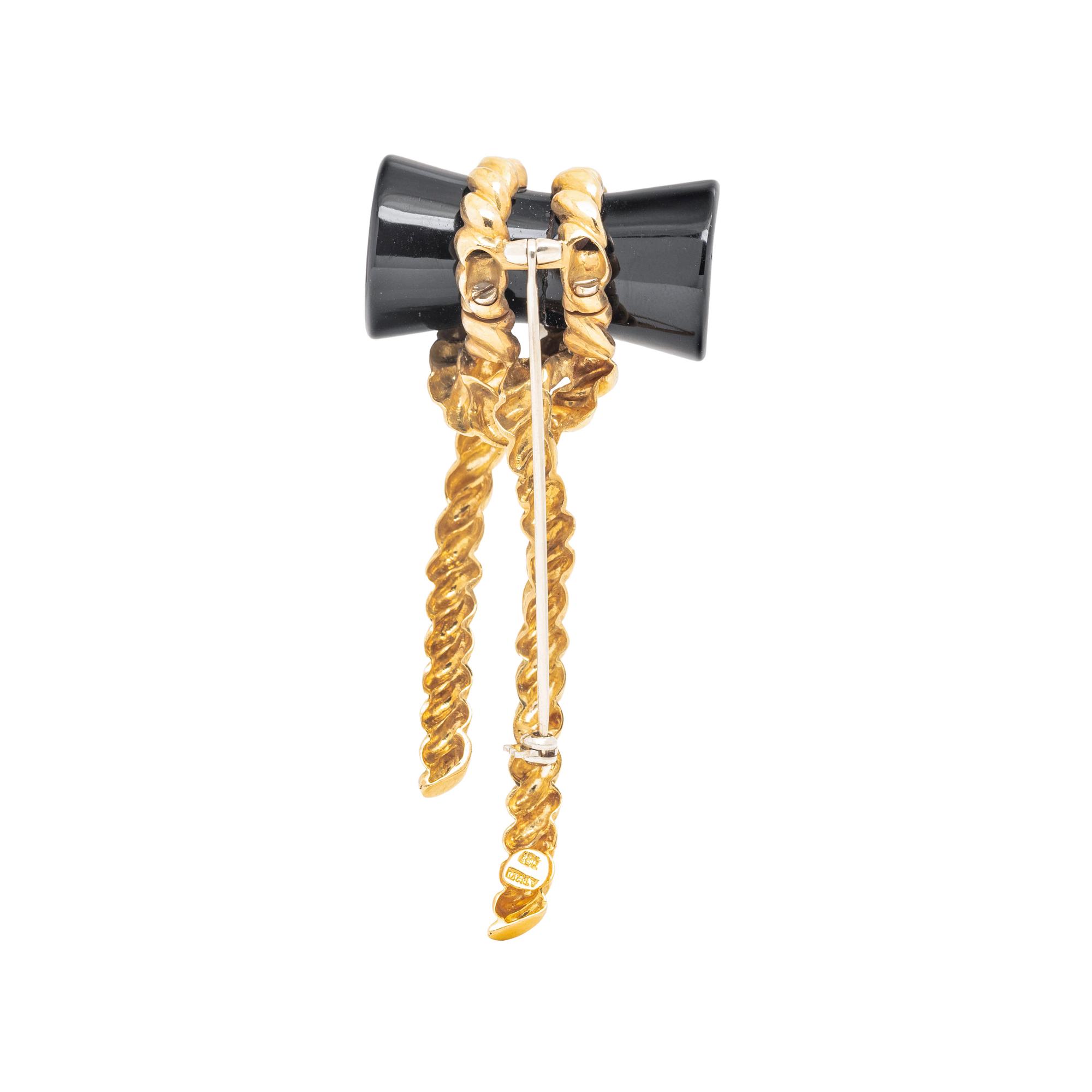 YELLOW GOLD AND ONYX BROOCH