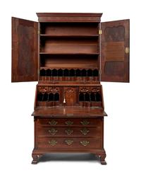 A Chippendale Figured and Carved Walnut Desk-and-Bookcase