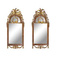 A Pair of Neoclassical Parcel Gilt Walnut Eagle-Decorated Looking Glasses