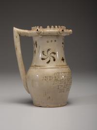 An Incised and Impressed Stoneware Puzzle Jug
