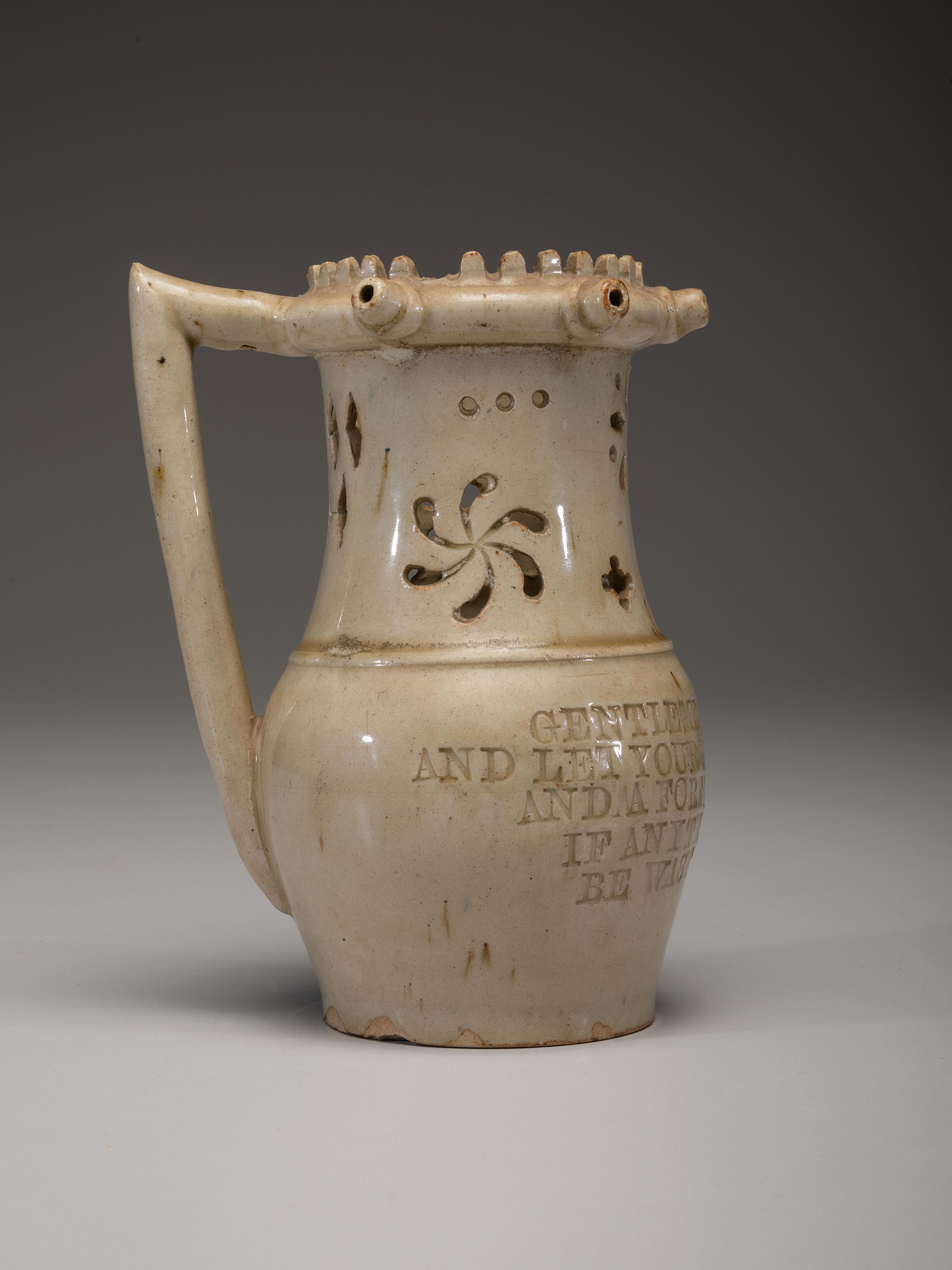 An Incised and Impressed Stoneware Puzzle Jug
