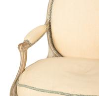 A Set of Four Louis XVI Grey-Painted and Parcel Gilt Fauteuils