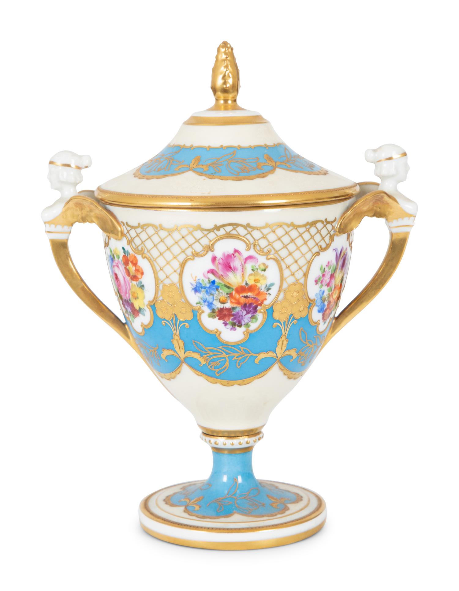 A Fürstenberg Porcelain Gilded Two-Handled Figural Urn