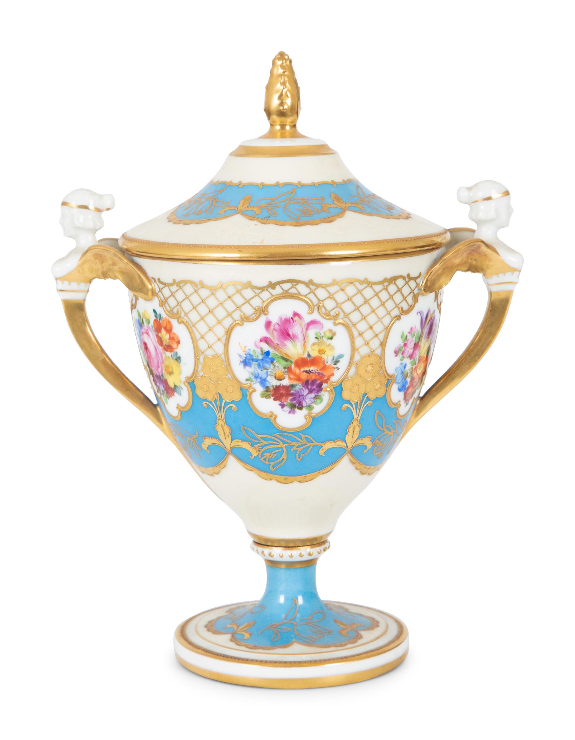 A Fürstenberg Porcelain Gilded Two-Handled Figural Urn